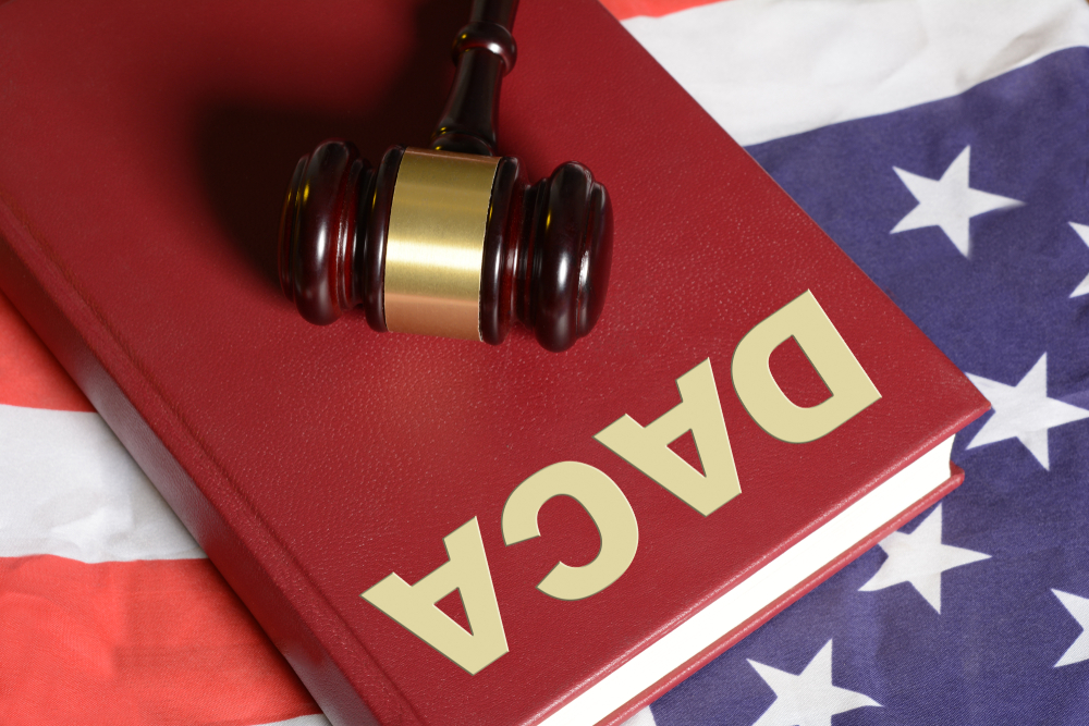 United States Immigration Law DACA with Flag and Gavel on book